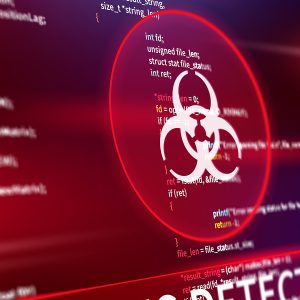 Pictorial representation of the npm packages supply chain attack. Screen displaying code with a prominent alert symbol and the words 'VIRUS DETECTED' highlighted in red.